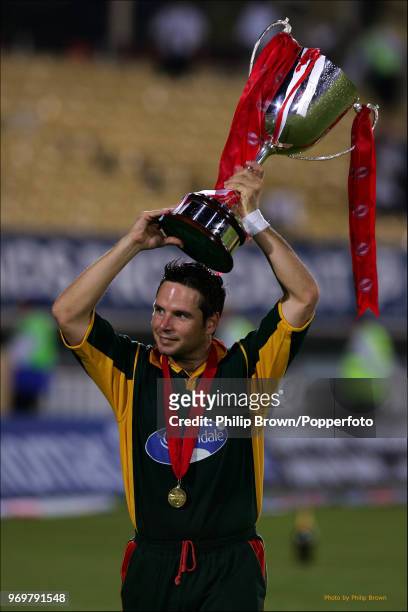 Leicestershire captain Brad Hodge parades around the ground with the trophy after Leicestershire won the Twenty20 Cup Final against Surrey by 7...