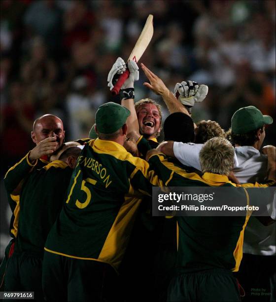 Leicestershire captain Brad Hodge is swamped by his teammates as Leicestershire celebrate winning the Twenty20 Cup Final against Surrey at Edgbaston,...