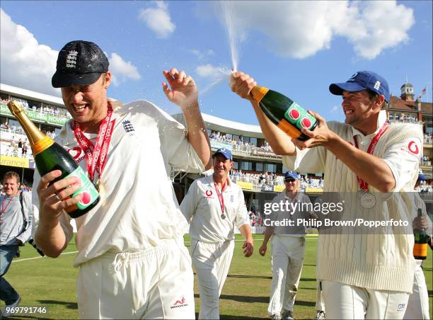 Steve Harmison of England sprays teammate Andrew Flintoff with champagne as England celebrate winning the 4th Test match between England and West...