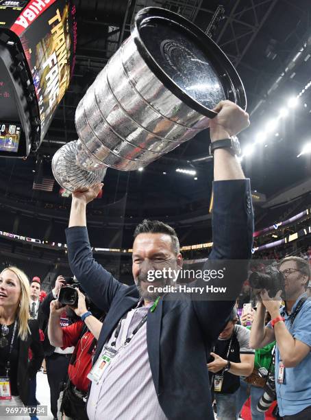 Goaltender coach Olaf Kolzig of the Washington Capitals hoists the Stanley Cup after his team defeated the Vegas Golden Knights 4-3 in Game Five of...