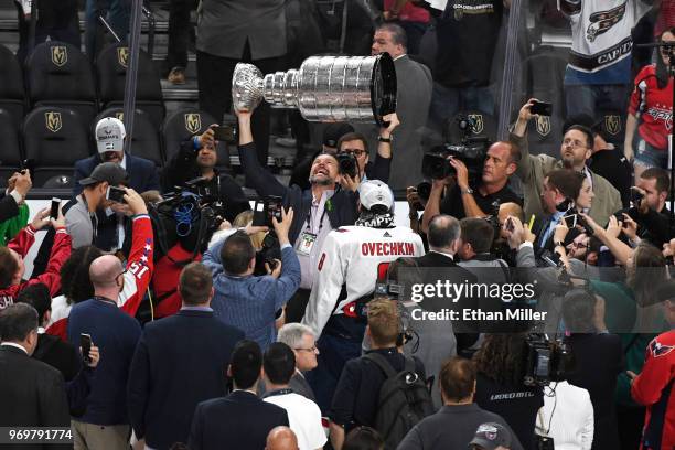 Goaltender coach Olaf Kolzig of the Washington Capitals hoists the Stanley Cup after his team defeated the Vegas Golden Knights 4-3 in Game Five of...