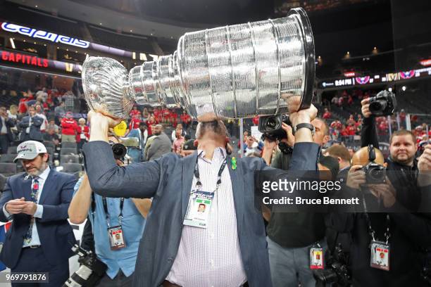 Goaltender coach Olaf Kolzig of the Washington Capitals hoists the Stanley Cup after his team defeated the Vegas Golden Knights 4-3 in Game Five of...