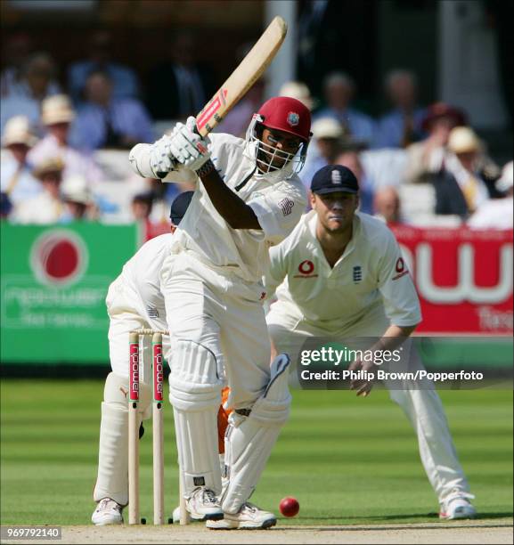 Shivnarine Chanderpaul of West Indies drives a delivery during his innings of 128 not out in the 1st Test match between England and West Indies at...