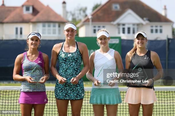 Runners up, Arina Rodionova of Australia and Yanina Wickmayer of Belgium with winners Jessica Moore and Ellen Perez of Australia during their Womens...