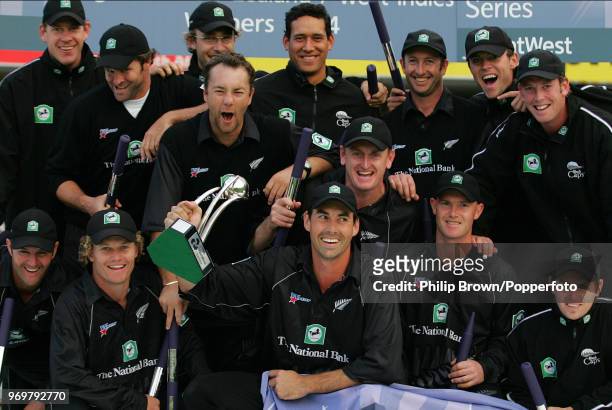 New Zealand captain Stephen Fleming holds the trophy as New Zealand celebrate winning the NatWest Series Final against West Indies at Lord's Cricket...