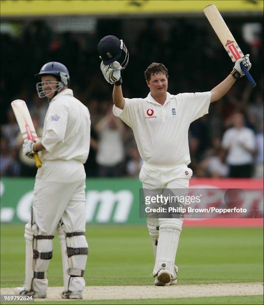 England batsman Robert Key celebrates reaching his maiden Test century during his innings of 221 as teammate Andrew Strauss applauds him in the 1st...