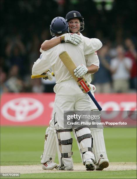 England batsman Robert Key is congratulated by teammate Andrew Strauss on reaching his maiden Test century during his innings of 221 in the 1st Test...