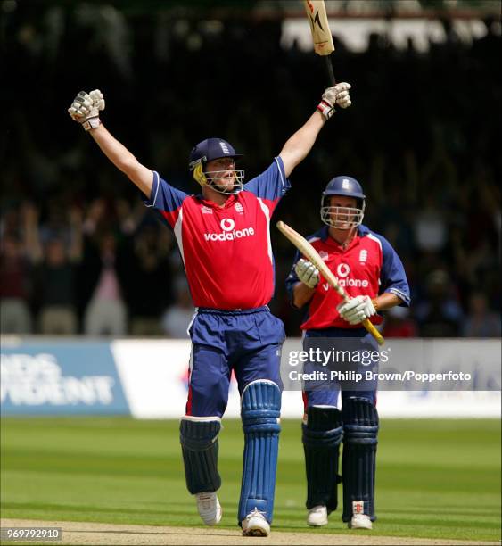 Andrew Flintoff of England celebrates his century during his innings of 123 runs as Andrew Strauss applauds in the NatWest Series One Day...