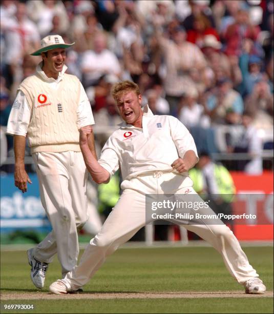 Andrew Flintoff of England celebrates with captain Michael Vaughan after getting Nathan Astle of New Zealand LBW for 0 during the 3rd Test match...