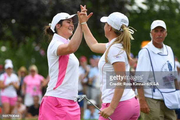 Paula Grant and Shannon McWilliam Great Britian & Ireland celebrate after a birdie putt on the 18th green during four-ball matches on day one of the...