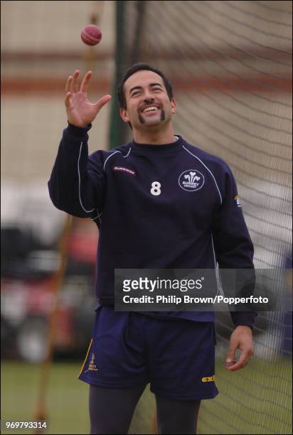 Adam Hollioake of Surrey catches a ball in the nets during a training session before the Frizzell County Championship match between Surrey and Sussex...