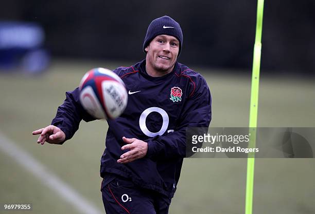 Jonny Wilkinson passes the ball during the England training session held at Pennyhill Park on February 23, 2010 in Bagshot, England.