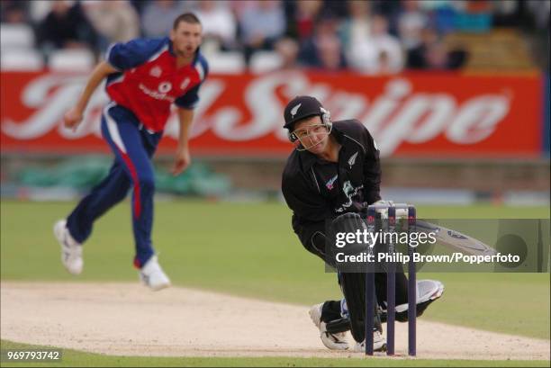 Nathan Astle of New Zealand is hit on the helmet by a delivery from England bowler Steve Harmison during the Natwest Series One Day International...