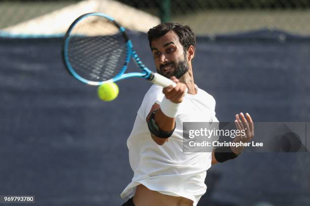 Yuki Bhambri of India in action against Alex De Minaur of Australia during their Quarter Final match on Day 7 of the Fuzion 100 Surbition Trophy on...