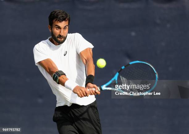 Yuki Bhambri of India in action against Alex De Minaur of Australia during their Quarter Final match on Day 7 of the Fuzion 100 Surbition Trophy on...