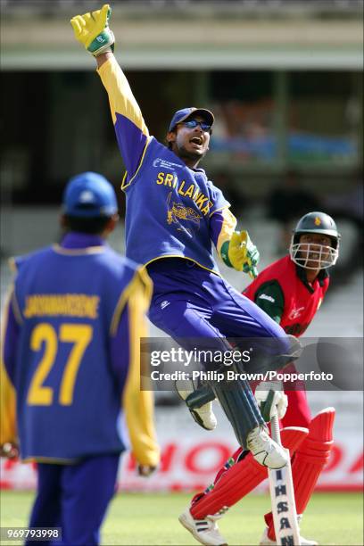 Kumar Sangakkara of Sri Lanka leaps to try and catch a wayward throw during the ICC Champions Trophy match between Sri Lanka and Zimbabwe at The...