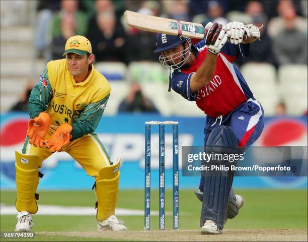 Michael Vaughan of England drives a delivery from Darren Lehmann of Australia during his innings of 86 runs in the ICC Champions Trophy Semi Final...