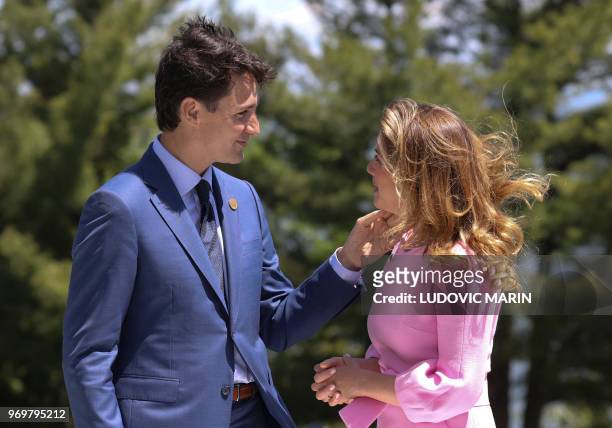 Canadian Prime Minister Justin Trudeau and his wife Sophie Gregoire Trudeau wait at the official welcome ceremony of the G7 summit on June 8 in La...