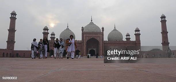 Pakistani tourists leave the Badshahi Mosque in Lahore on February 13, 2010. Construction of the Badshahi Mosque was ordered in May 1671 by the sixth...