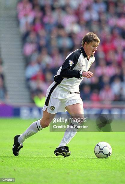 Ole Gunnar Solskjaer of Manchester United runs with the ball during the FA Barclaycard Premiership match against Sunderland played at the Stadium of...