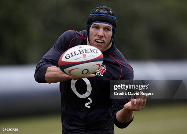 James Haskell passes the ball during the England training session held at Pennyhill Park on February 23, 2010 in Bagshot, England.