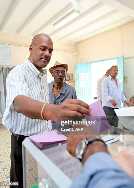 Serge Letchimy, Fort-de-France mayor, casts his vote in the polling station of the Trenelle Citron quarter of Fort-de-France on the Caribbean island...