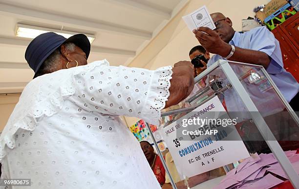 Woman casts her vote in the polling station of the Trenelle Citron quarter of Fort-de-France on the Caribbean island of Martinique, on January 10 for...