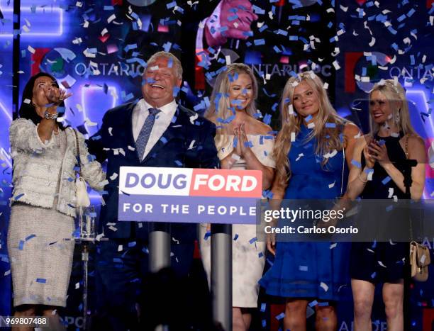 Ontario PC leader Doug Ford reacts after winning the Ontario Provincial election to become the new premier in Toronto, on Thursday. From left ate:...