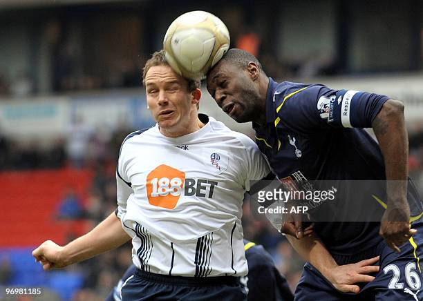 Tottenham Hotspur's English defender Ledley King vies with Bolton Wanderers' English forward Kevin Davies during the FA Cup Fifth round football...