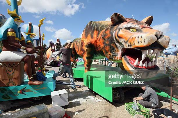 Artists work on parade floats in Kalmaniya, near Kfar Saba, on February 23, 2010 in preparation for the Jewish holiday of Purim. The carnival-like...