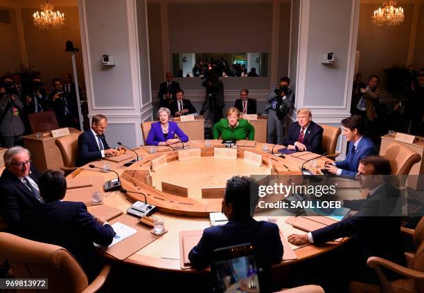 Leaders of the G7 participate in a working session of the G7 Summit in La Malbaie, Quebec, Canada, June 8, 2018. - Seated clockwise from top center:...