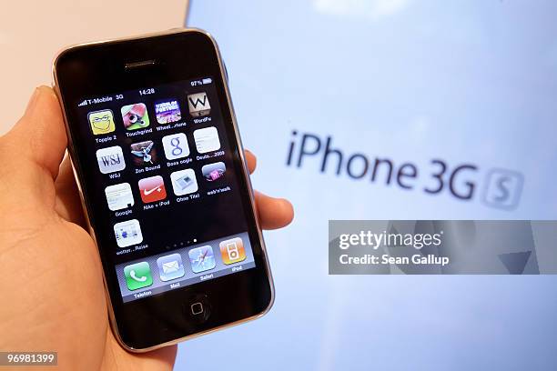 The photographer holds an iPhone at a shop of German telecommunications provider Deutsche Telekom on February 23, 2010 in Berlin, Germany. Deutsche...