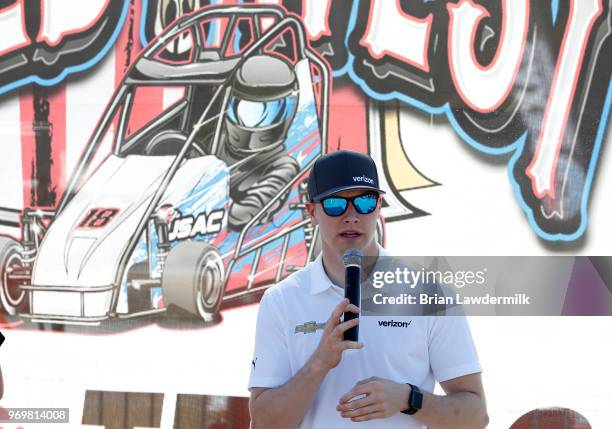 Josef Newgarden, driver of the Verizon Team Penske Chevrolet, visits with the USAC Quarter Midget racing participants during practice for the Verizon...