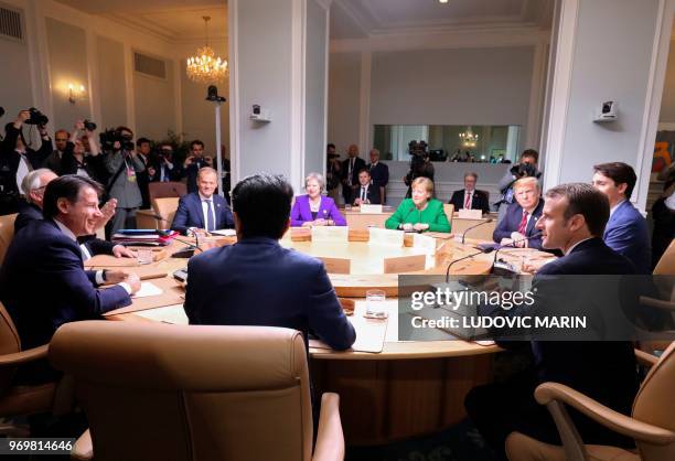 Leaders of the G7 participate in a working session of the G7 Summit in La Malbaie, Quebec, Canada, June 8, 2018. - Seated clockwise from top center:...