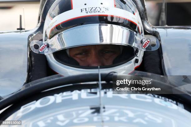 Ed Carpenter, driver of the Ed Carpenter Racing Fuzzy's Vodka Chevrolet, sits in his car during practice for the Verizon IndyCar Series DXC...