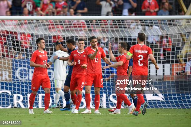 Rodriguez Ricardo of Switzerland celebrates scoring the opening goal with his team mates during the international friendly match between Switzerland...