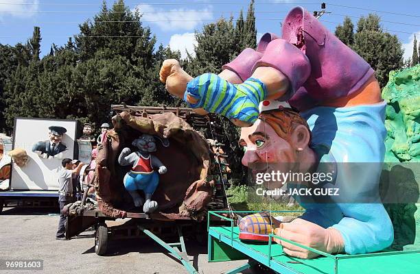 Artists work on parade floats in Kalmaniya, near Kfar Saba, on February 23, 2010 in preparation for the Jewish holiday of Purim. The carnival-like...