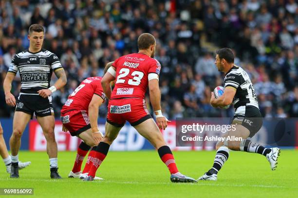 Mark Minichiello of Hull FC looks for a gap to run through during the Betfred Super League match between Hull FC and Salford Red Devils at KCOM...