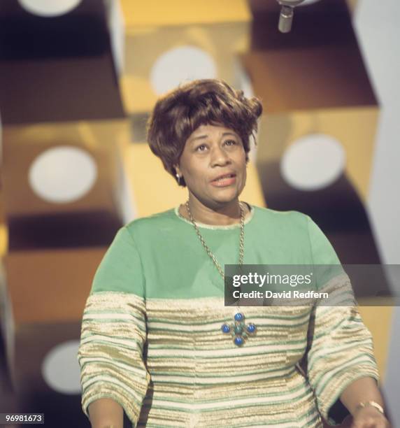 American jazz singer Ella Fitzgerald performs on stage during the recording of a television show in London in 1964.