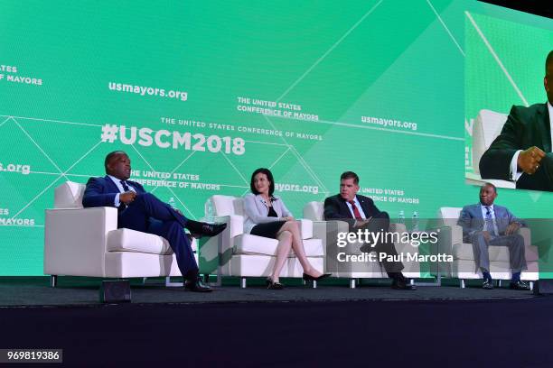 Steve Benjamin, Sheryl Sandberg, Marty Walsh and Sylvester Turner speak at the U.S. Conference Of Mayors on June 8, 2018 in Boston, Massachusetts.