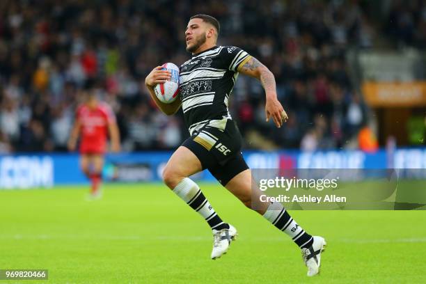 Hakim Miloudi of Hull FC runs towards the try line during the Betfred Super League match between Hull FC and Salford Red Devils at KCOM Stadium on...