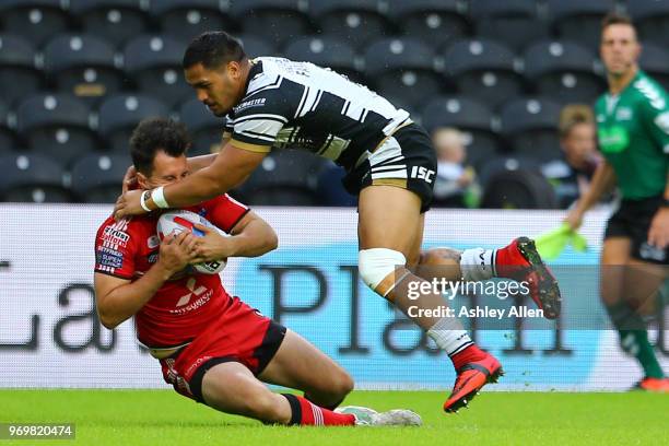 Bureta Faraimo of Hull FC tackles Jack Littlejohn of Salford Red Devils during the Betfred Super League match between Hull FC and Salford Red Devils...