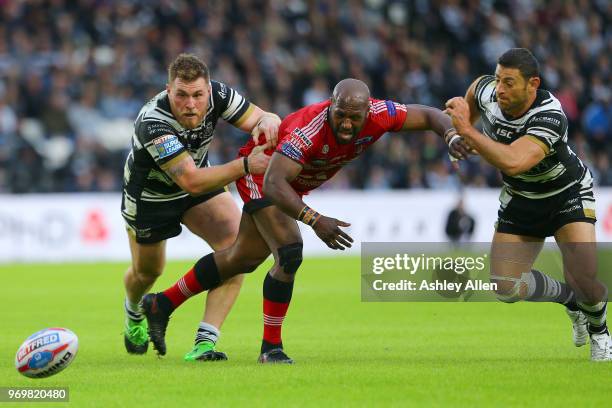 Scott Taylor and Mark Minichiello of Hull FC battle Robert Lui of Salford Red Devils during the Betfred Super League match between Hull FC and...