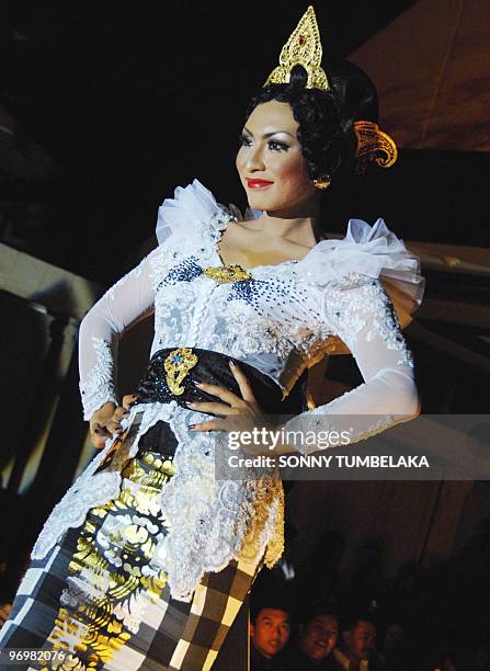 Transvestite performs during a beauty contest in Sanur, in the resort island of Bali, on February 20, 2010. The pageant which followed 24 contestants...