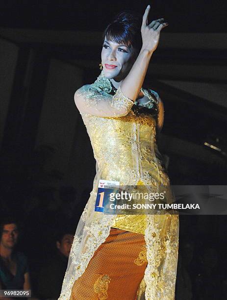 Transvestite performs during a beauty contest in Sanur, in the resort island of Bali, on February 20, 2010. The pageant which followed 24 contestants...