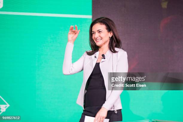 Facebook COO Sheryl Sandberg takes the stage during a session on how communities can use technology to grow and thrive at the U.S. Conference Of...