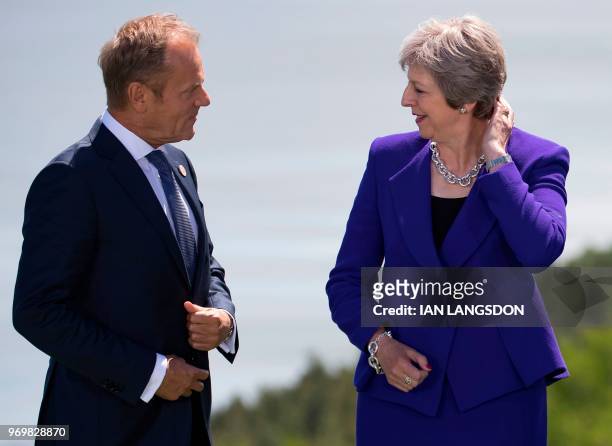 British Prime Minister Theresa May and European Council President Donald Tusk attend the family photo at the G7 Summit in La Malbaie, Canada, June 8,...