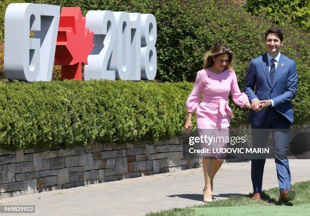 Canadian Prime Minister Justin Trudeau and his wife Sophie-Gregoire Trudeau walk to the official welcome ceremony of the G7 summit on June 8 in La...