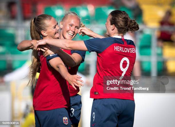 Lisa Marie Utland, Maria Thorisdottir, Isabell Herlovsen of Norway celebrates the second goal during 2019 FIFA Womens World Cup Qualifier between...