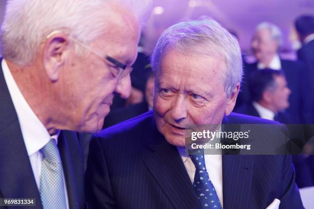 Wolfgang Porsche, chairman of Porsche SE, right, speaks to an attendee as the luxury automaker celebrates its 70th anniversary in Stuttgart, Germany,...